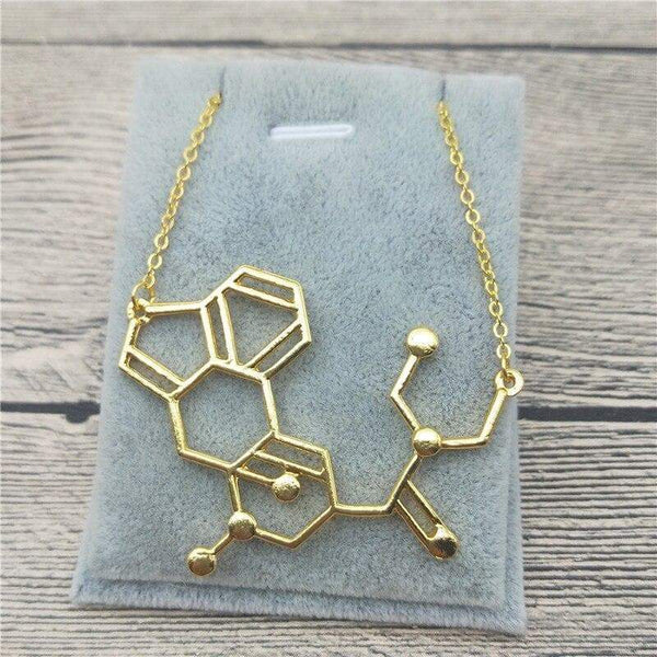 the sexy scientist bijoux science gold dopamine molecule necklace